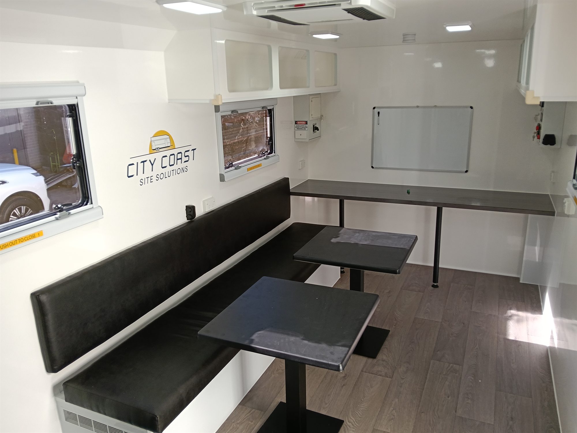 Site caravan interior seating and workspace