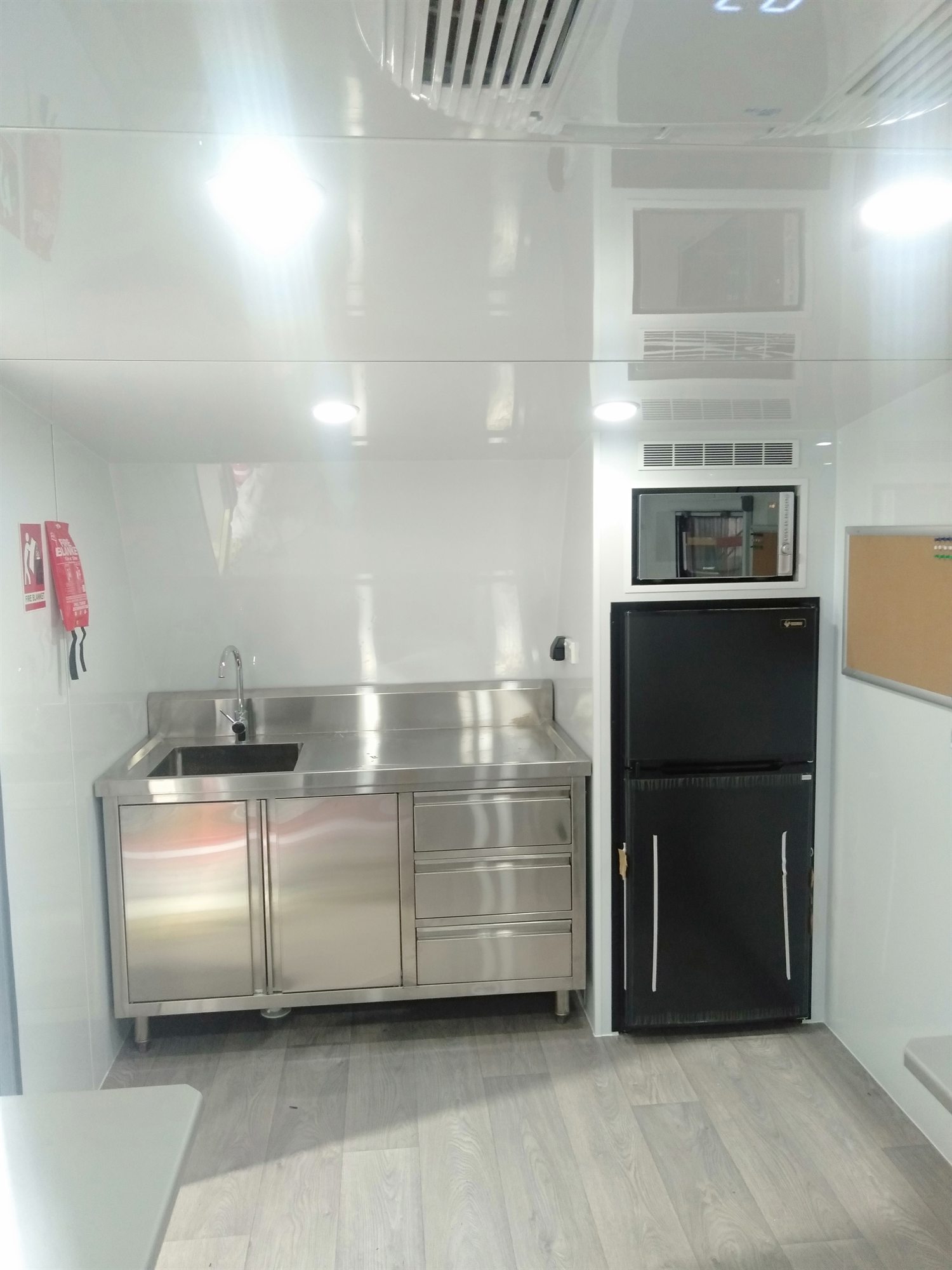 Site Van - Kitchen, sink and fridge